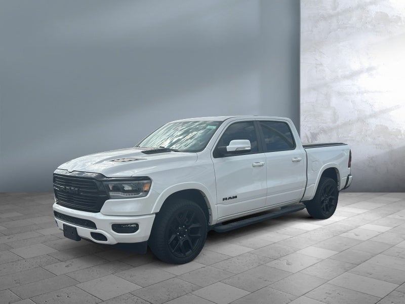 2020 RAM 1500 Laramie in Ivory White Tri-Coat Pearlcoat — front three-quarter view