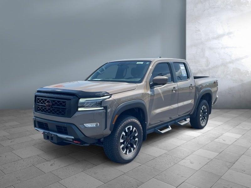 2024 Nissan Frontier PRO-4X in Baja Storm — front three-quarter view