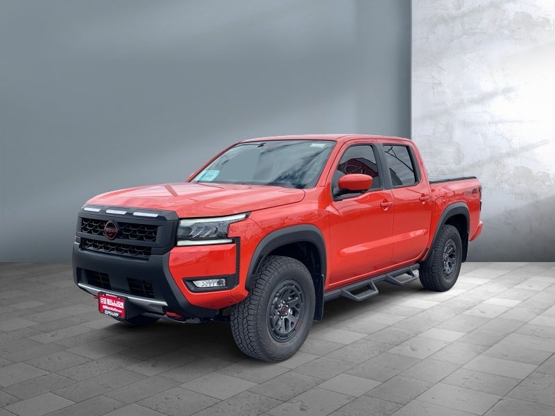 2026 Nissan Frontier PRO-4X in Afterburn Orange — front three-quarter view